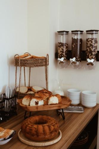 a table with breads and other foods on it at OXYGEN Shekvetili in Shekvetili