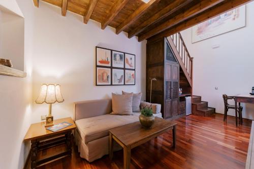 a living room with a couch and a table at Zacosta Villa Hotel in Rhodes Town