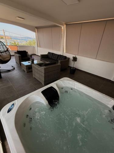 a large bath tub in a living room at Apartment Leona & Doris in Bibinje