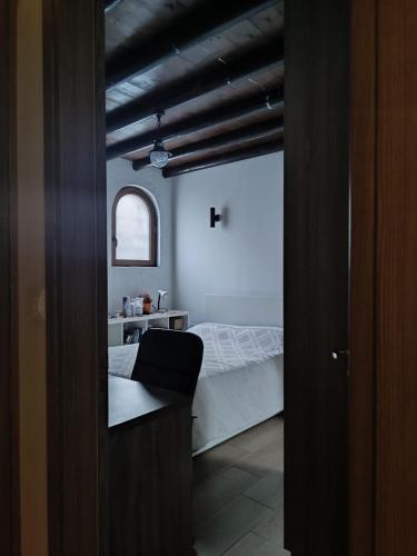 a view of a bedroom with a bed and a window at Stone Garden Oasis Cottage in Limassol