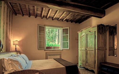 Katil atau katil-katil dalam bilik di Agriturismo Settesoldi