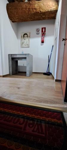 a living room with a fireplace and a wooden floor at A casa di Elizabeth in Porcari