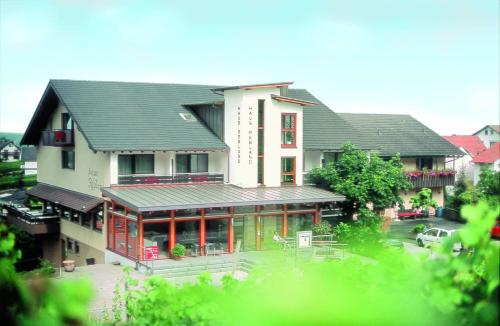 a large white house with a lot of windows at Haus Rebland Urlaubsglück-Hotel in Baden-Baden