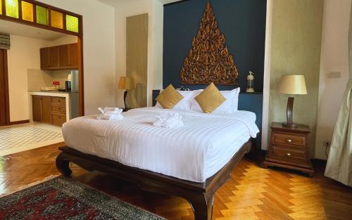 Una cama o camas en una habitación de Baleeyan