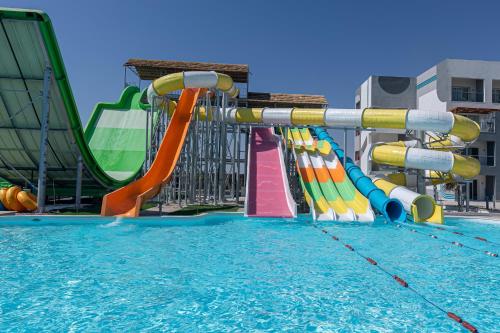 a water park with a slide in a swimming pool at Amwaj Beach Club Abu Soma in Hurghada