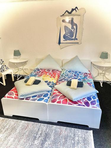 a bed in a room with two pillows on it at Hotel Tusculum in Marburg an der Lahn