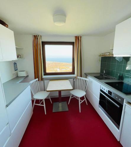 Una cocina o cocineta en Haus Rooad Weeter