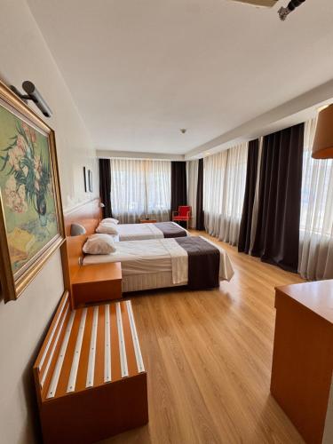 Postel nebo postele na pokoji v ubytování SİMİSSO HOTEL