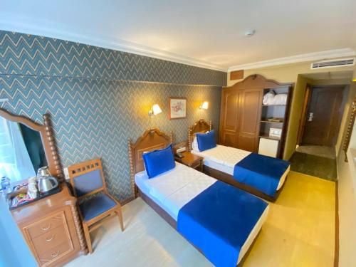 Letto o letti in una camera di Hotel Büyük Levent