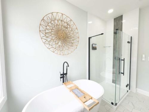 a bathroom with a toilet and a glass shower at Jennifer's Spa-Like Apt King Bed Historic Broadway in Providence