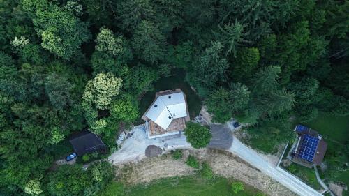 an overhead view of a house in the forest at Savinjski raj in Mozirje