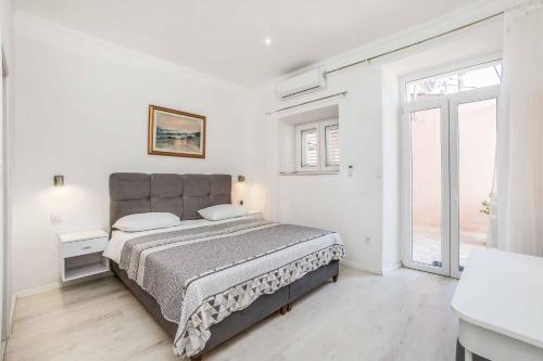 Ένα ή περισσότερα κρεβάτια σε δωμάτιο στο Villa Adriatic Pearl