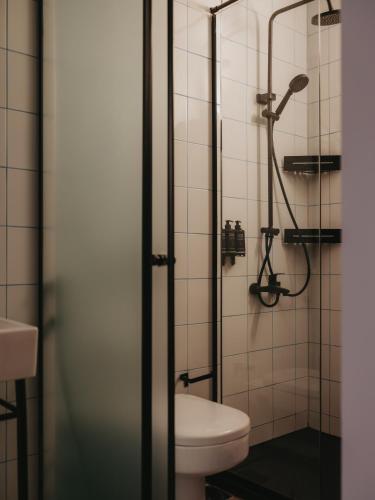 a bathroom with a toilet and a shower at Brassbell l DT l Hannaux l Tahrir sq in Cairo