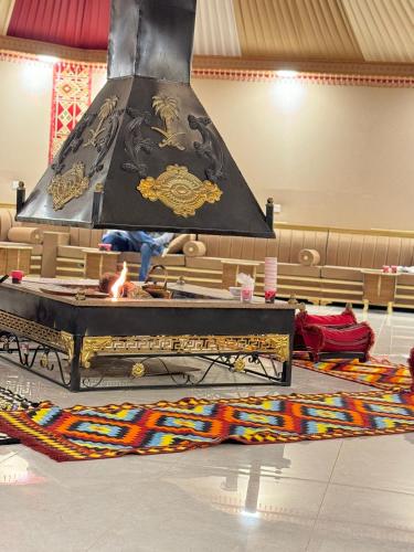 a large chandelier hanging over a altar in a synagogue at Wadi Rum Legend Luxury Camp in Wadi Rum