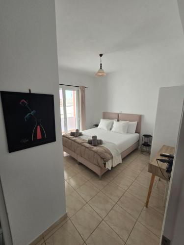 a bedroom with a bed and a couch at Villa Papa in Ksamil