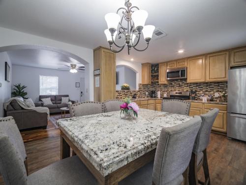 a kitchen and dining room with a table and chairs at Cozy House in Austin