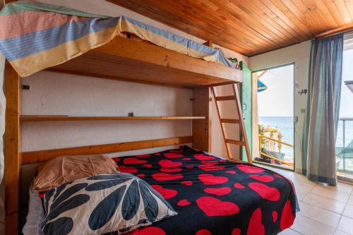 En eller flere senge i et værelse på Appartement Escaliers