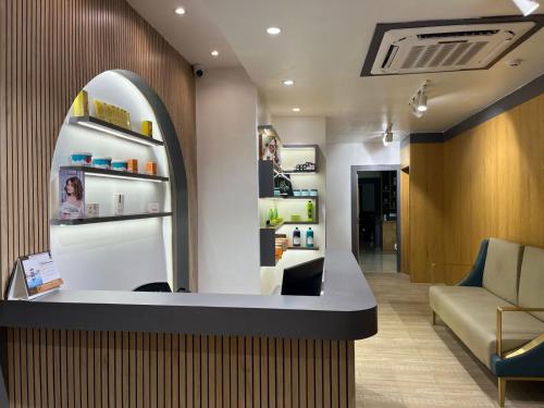 a salon with a waiting room with a couch at The Royal Bihar in Patna