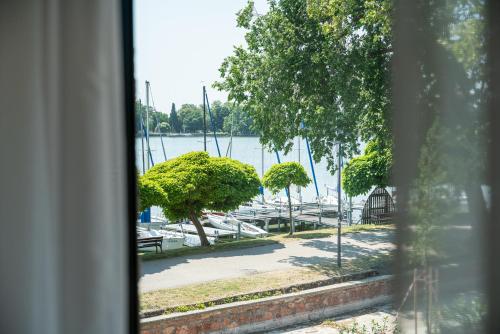 a view of a marina from a window at Malom és Kacsa Boutique Hotel in Tata