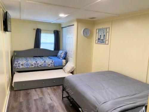 a small bedroom with a bed in a trailer at Entire Punta Gorda Home Sleeps 7 Close to US-41 & I-75 in Punta Gorda