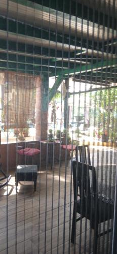 a room with two chairs and a room with windows at Smestaj sa bazenom Sunny Hill in Smederevska Palanka