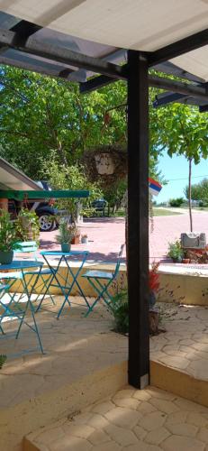 a picnic table and chairs under a pavilion at Smestaj sa bazenom Sunny Hill in Smederevska Palanka