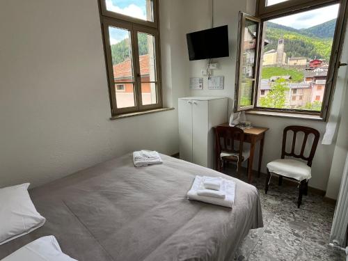 Postel nebo postele na pokoji v ubytování foresteria ca' mon