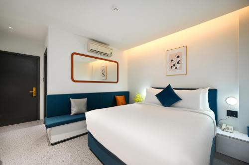 En eller flere senge i et værelse på Brown Dot Hotel Saigon Airport