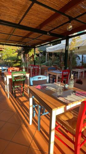 a wooden table and chairs on a patio at B&b Rosaria sea view in Vietri sul Mare