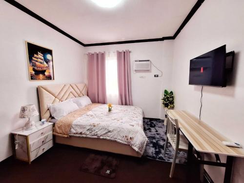 Un ou plusieurs lits dans un hébergement de l'établissement EA3 Affordable Apartment Room Transient House Near SM Ecoland, Davao Coastal Road and Ecoland Bus Terminal