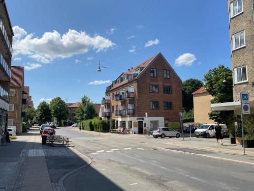 an empty street in a city with a building at Metro Apartment Linde Alle 14, 3Th 2720 Vanløse in Copenhagen