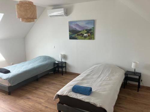 Ένα ή περισσότερα κρεβάτια σε δωμάτιο στο Maison au cœur des Bertranges