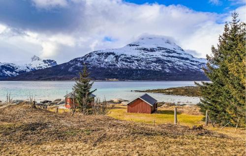 a snow covered mountain with a barn and a lake at 4 Bedroom Cozy Home In Hol I Tjeldsund in Dragland