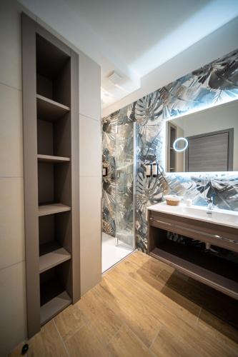 a bathroom with a sink and a mirror at Residence Diana Seafront in Bibione