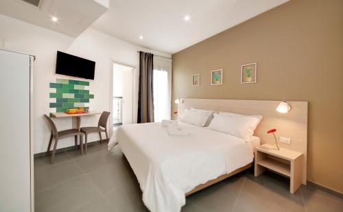 Un pat sau paturi într-o cameră la Residence Dei Viali