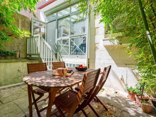 a table and chairs sitting on a patio at Holiday Home Victor Hugo by Interhome in Deauville