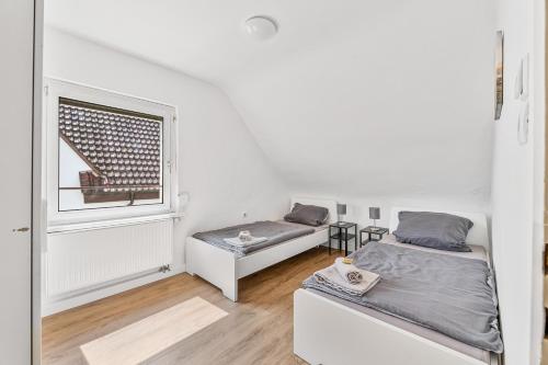 Katil atau katil-katil dalam bilik di Monteur Apartments Oberboihingen near Stuttgart Parking,Wifi,Smart,Smart TV