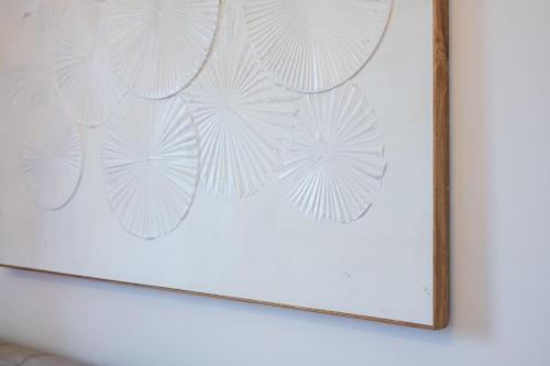 a picture of a painting of leaves on a wall at Private Parking - Sea View - Terrace - AC in Lavagna