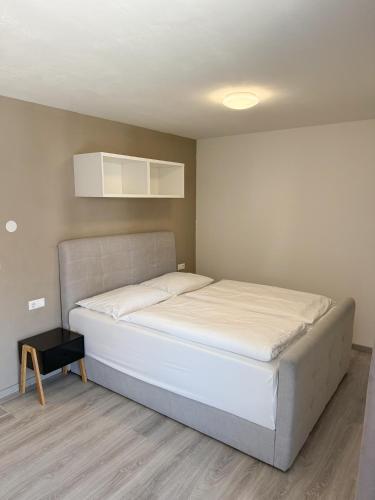 Ένα ή περισσότερα κρεβάτια σε δωμάτιο στο Residence Laurin Apartments