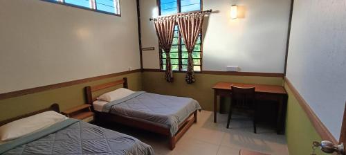 Letto o letti in una camera di Sepilok B&B