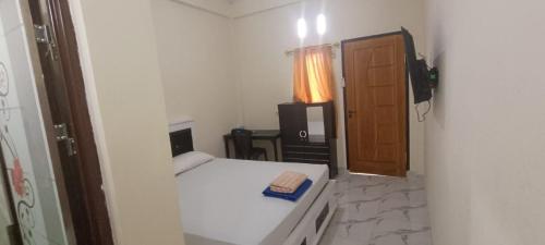 Postel nebo postele na pokoji v ubytování KB HOMESTAY Mongkonai