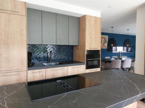 a kitchen with a sink and a counter top at Strandcamping Valkenisse in Biggekerke