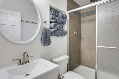 a bathroom with a sink and a toilet and a mirror at Boat Ramp Access Dog-Friendly Kentucky Lake Gem in New Johnsonville