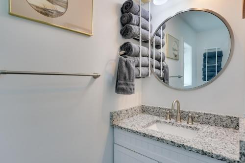 a bathroom with a sink and a mirror at Shared Boat Ramp at Kentucky Lake Retreat in New Johnsonville