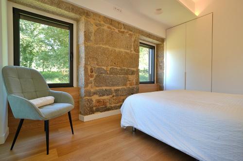 Ένα ή περισσότερα κρεβάτια σε δωμάτιο στο Lujosa villa con piscina