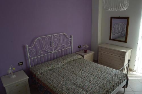 Ένα ή περισσότερα κρεβάτια σε δωμάτιο στο Il Melograno