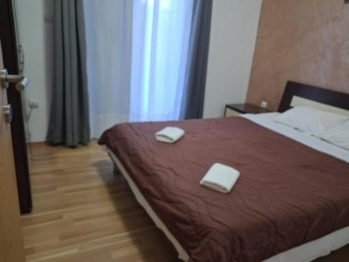 Ένα ή περισσότερα κρεβάτια σε δωμάτιο στο Apartmani Jaz 24