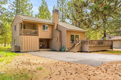 a house with a large driveway in front of it at Infinite Adventure in Sunriver