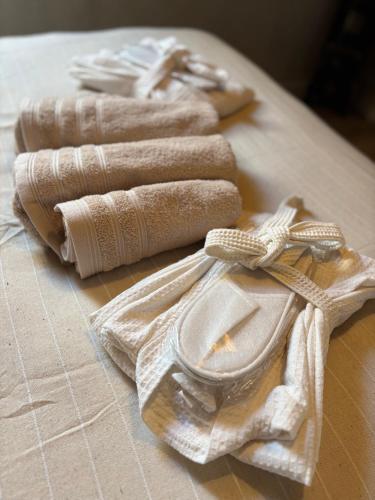 a group of folded towels on a table at Au ptit Gaston in Durbuy