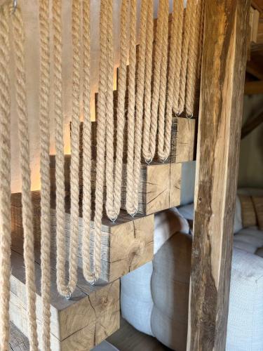a wooden staircase with wood treads on it at Au ptit Gaston in Durbuy